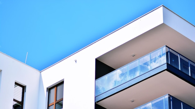 a white house with a blue sky and a window