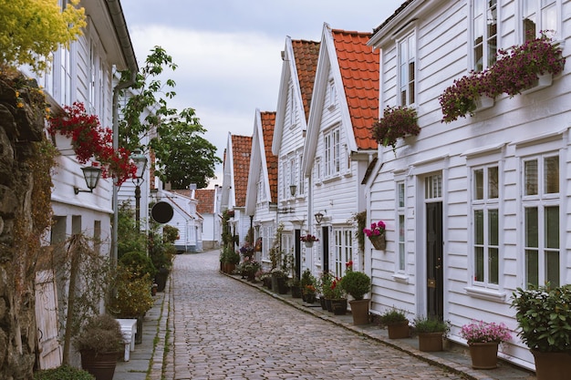 white houses with a red roof in the town of Stavanger Norway