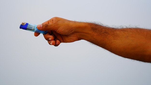 White isolatedfire lighter in the hand and giving to anyone