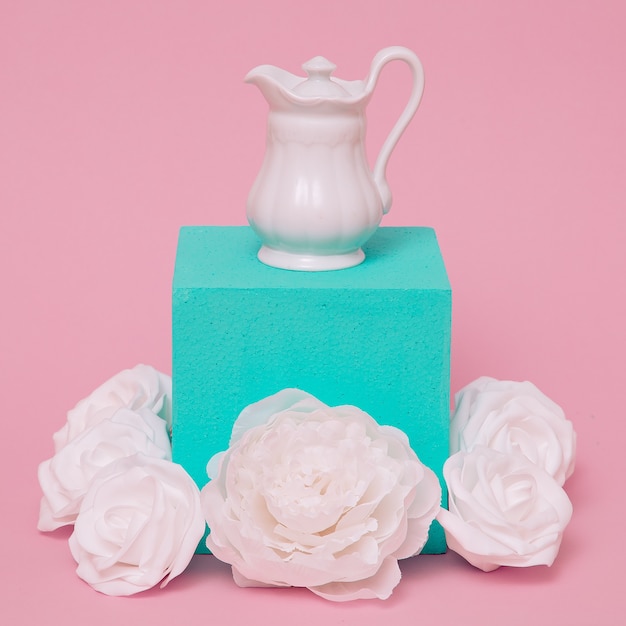 White jug and flower composition. Minimal art