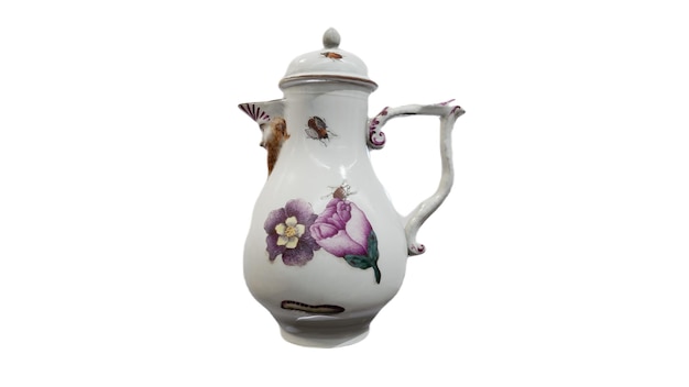 A white jug with a flower design on the front.