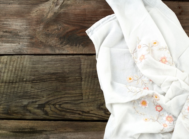 White kitchen textile towel folded on a gray wooden table