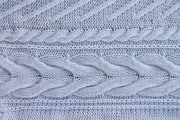 White knitted sweater background. Top view. Copy space