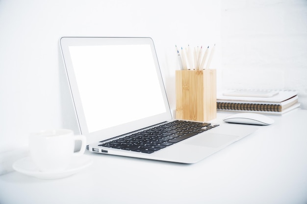 White laptop and coffee