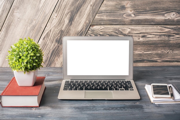 White laptop on desk front