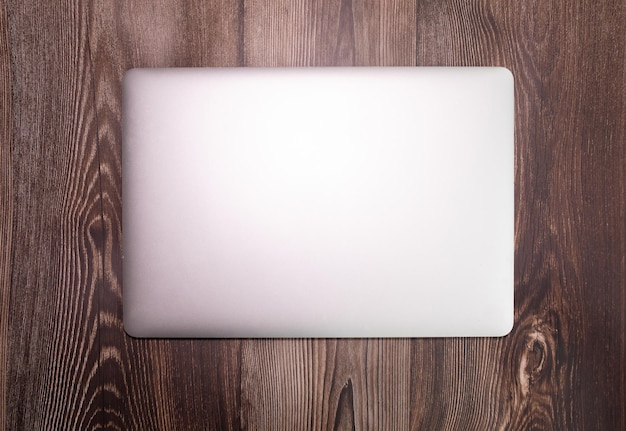 A white laptop with the word mac on it