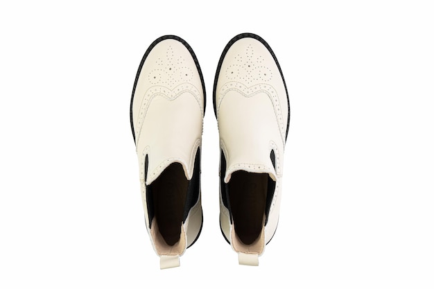 White leather chelsea boots Isolated closeup on white background Top view Fashion shoes