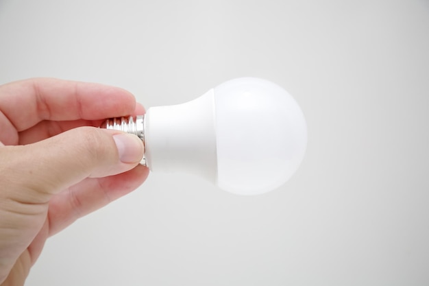 White LED bulb in the hand energysaving