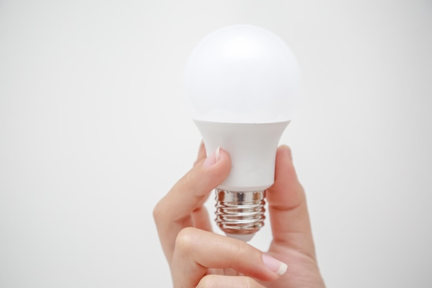 White LED bulb in the hand energysaving