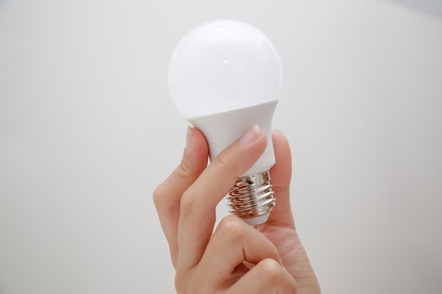 White LED bulb in the hand energysaving