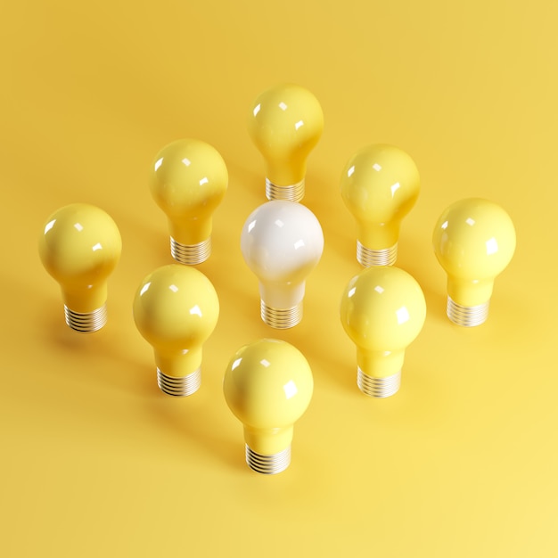 White light bulb among yellow light bulbs on yellow 