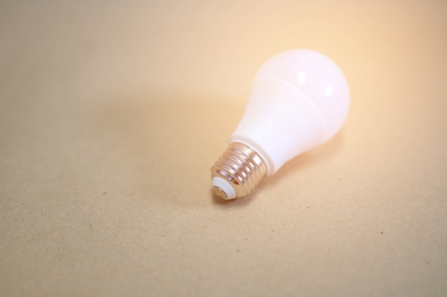 White light bulbs placed on brown paper