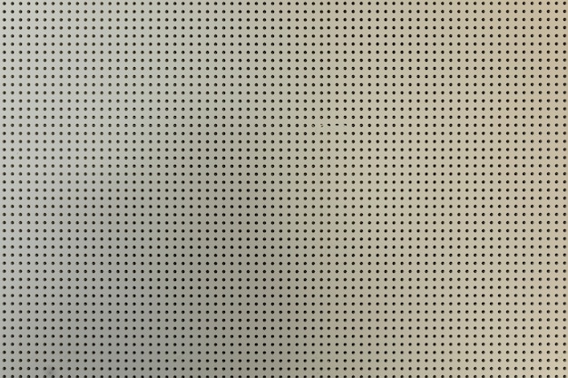 white light perforated plasterboard wall