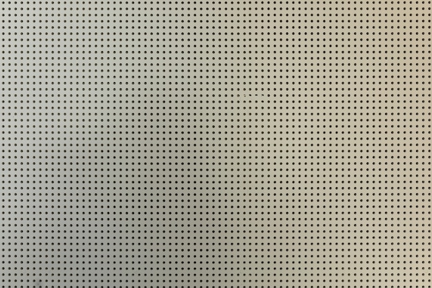 White light perforated plasterboard wall