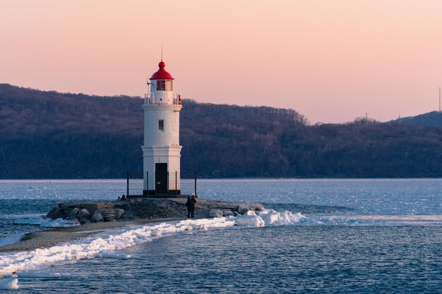 White lighthouse with red roof on Tokarev cat