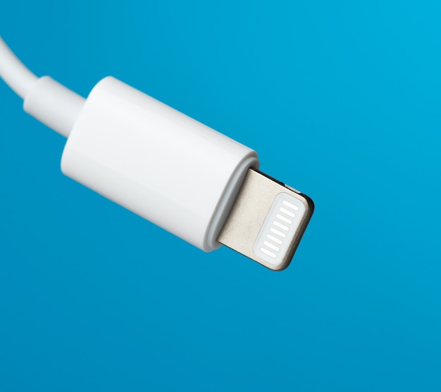 White lightning cable on a blue background