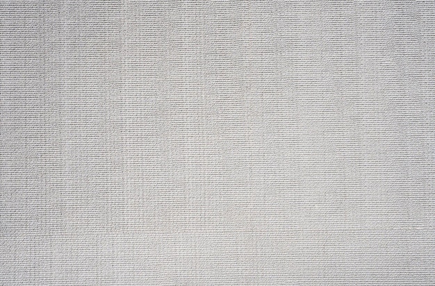 A white linen fabric with a woven pattern