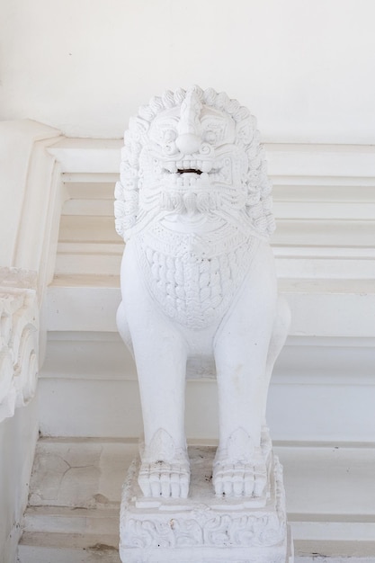 White lion in the white temple of thailand wat sawang arom