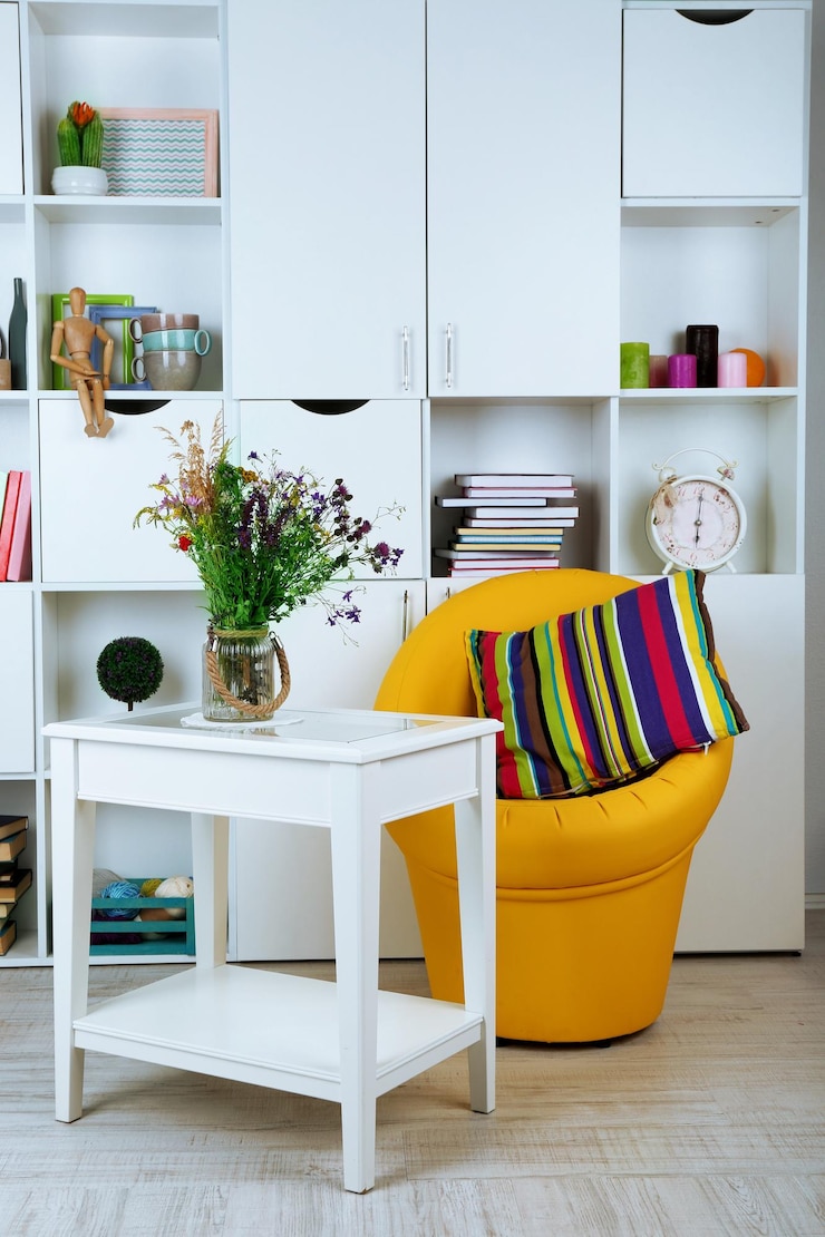 Photo white living room with armchair and bookcase