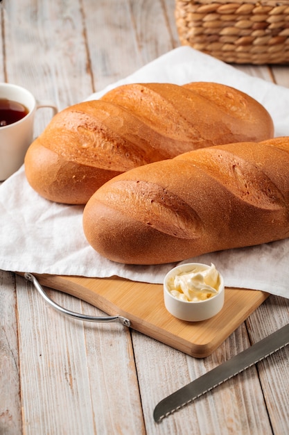 White loaf breads with butter and coffee