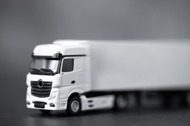 White long truck with a trailer isolated on dark background with clipping path