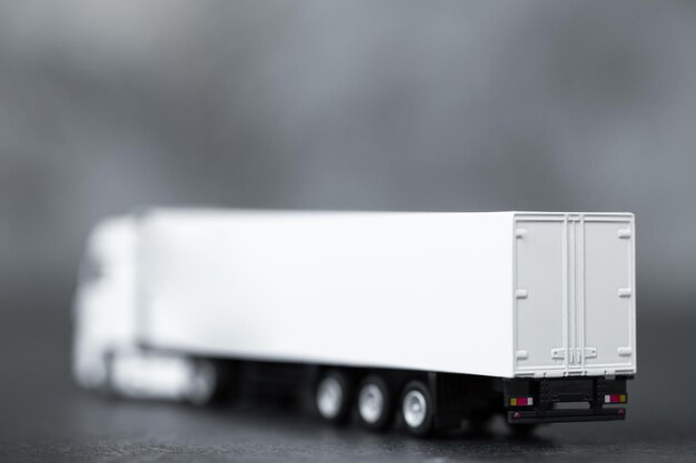 White long truck with a trailer isolated on dark background with clipping path