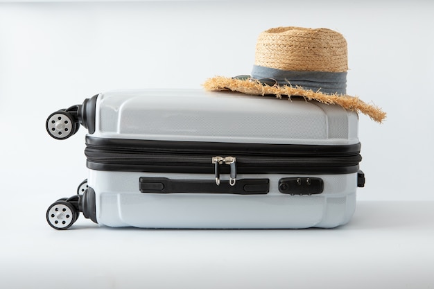 White luggage hat travel journey to destination long weekend holiday on white background 