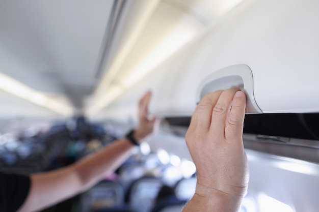 White luggage panel in empty airplane