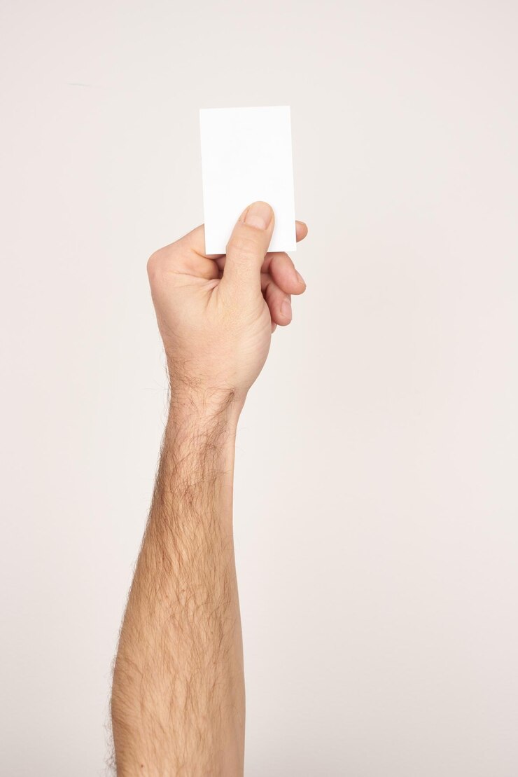 Photo white male hand giving card. business card. white isolated background.