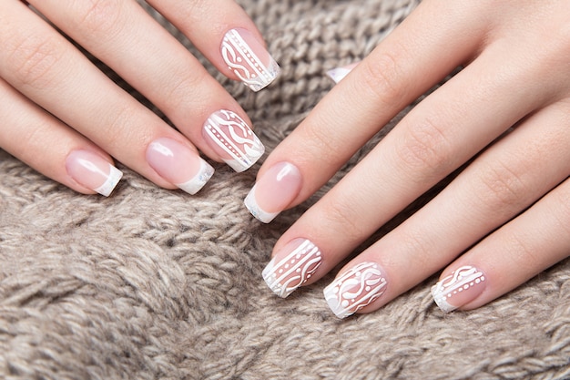 White manicure on hands