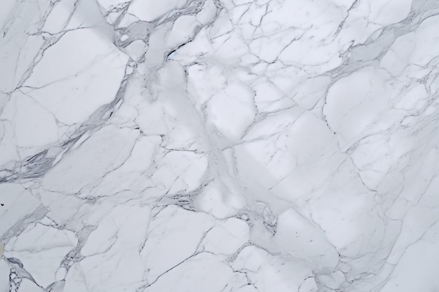 A white marble wall with a dark grey background.