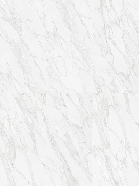 Photo a white marble wall with a design on it