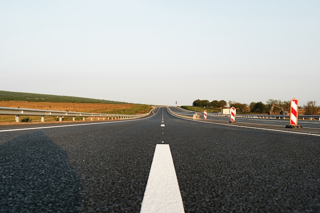 White marking line on asphalt road on highway