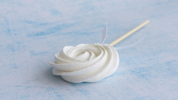 A white marshmallow cake pop on a stick