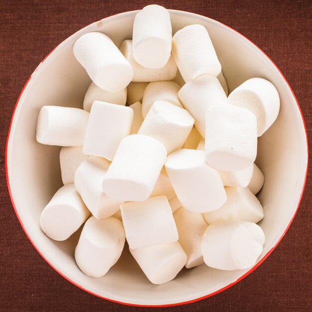 White marshmallows close up in a bowl