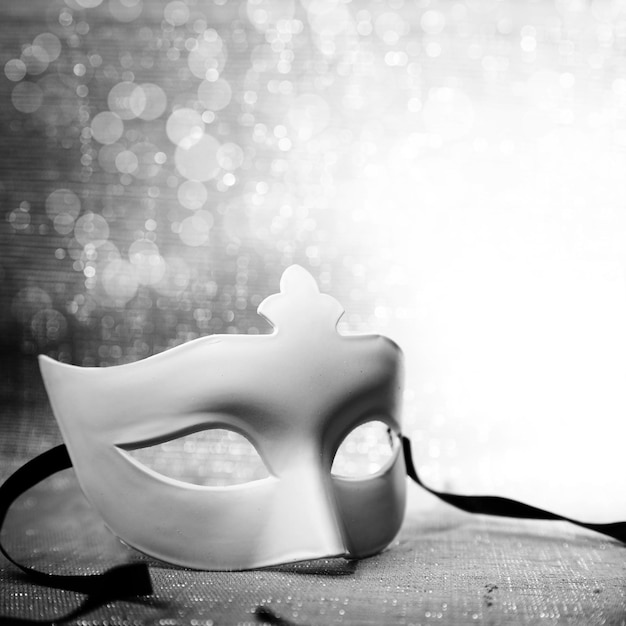 White mask with glittering background