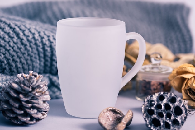 White matte glass coffee mug with winter decoration