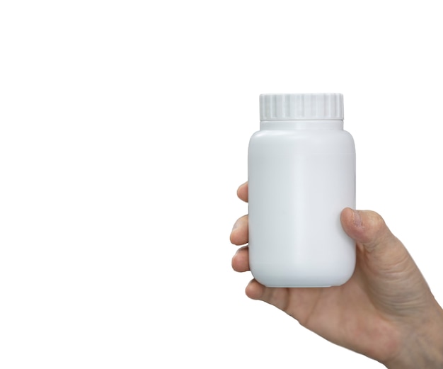 White medicine bottle in women hand on white 