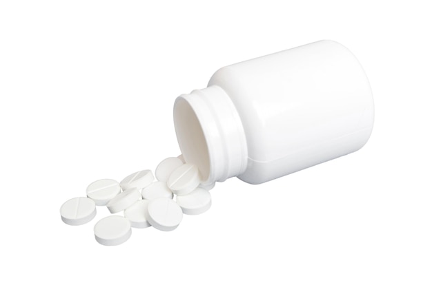 White medicines flow from container medicine white pill bottle isolated on a white background