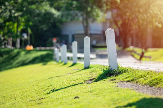 White milestone at country road side for target business step forward indicator concept