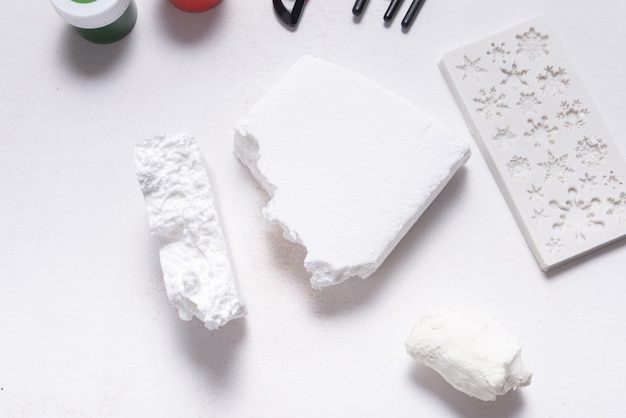 White modeling soft clay for hobby and craft, on wooden table