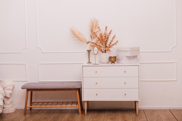 White modern chest of drawers in the home interior