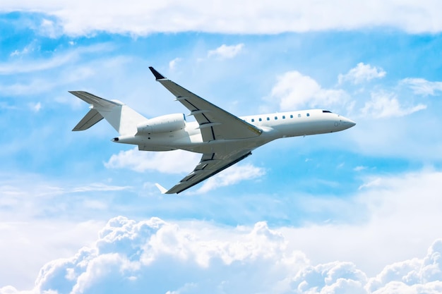 White modern executive airplane fly in the sky