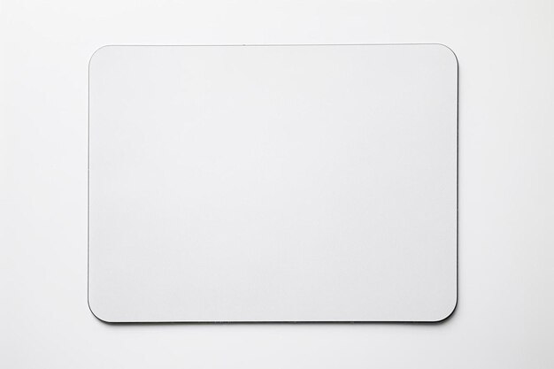 Foto un mouse pad bianco seduto in cima a un tavolo