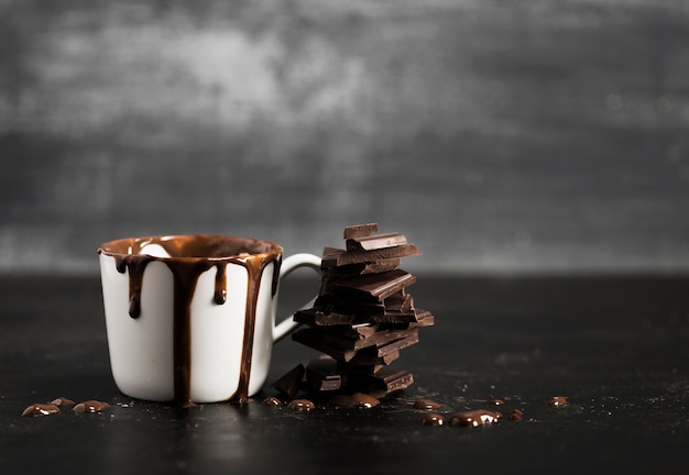 White mug filled with chocolate and copy space