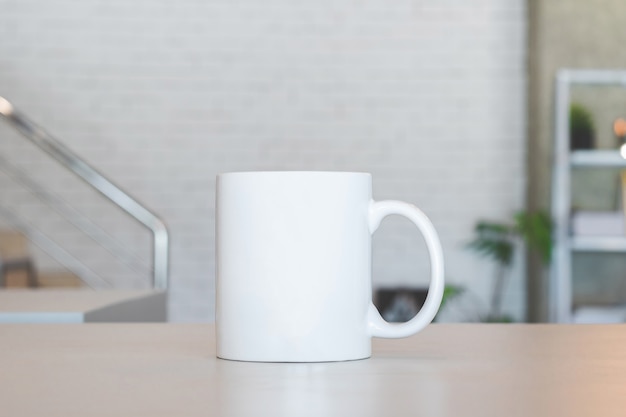 White mug on table and modern room background