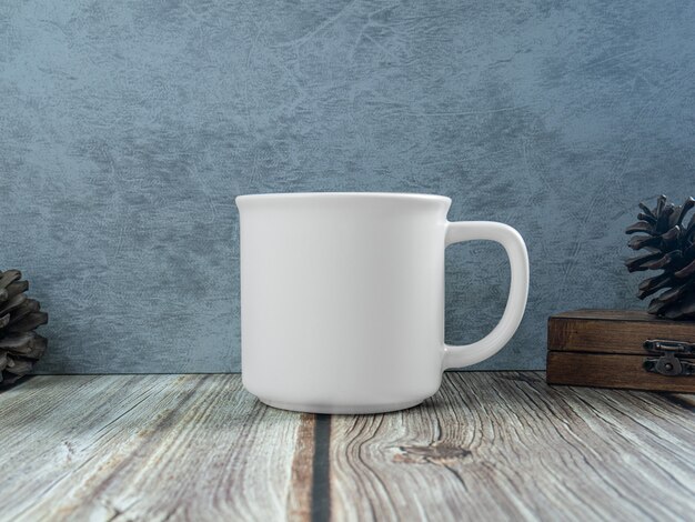 The white mug on table wood for mockup or background