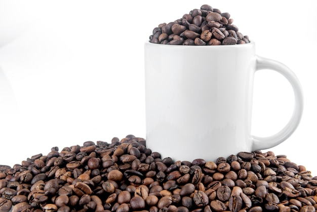 White mug with coffee beans
