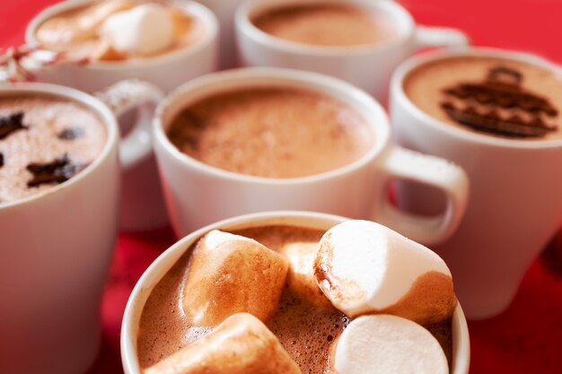 White mugs with hot cocoa and marshmallows