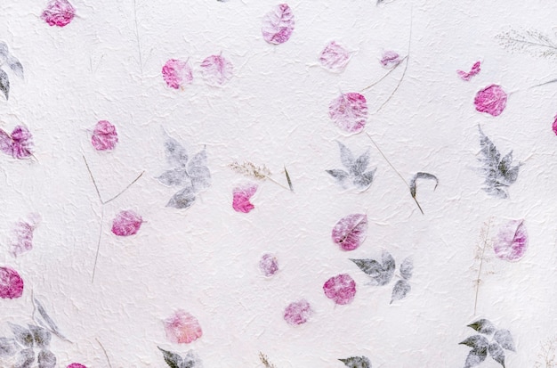 White mulberry paper with the texture of flowers and foliage is used as a background.